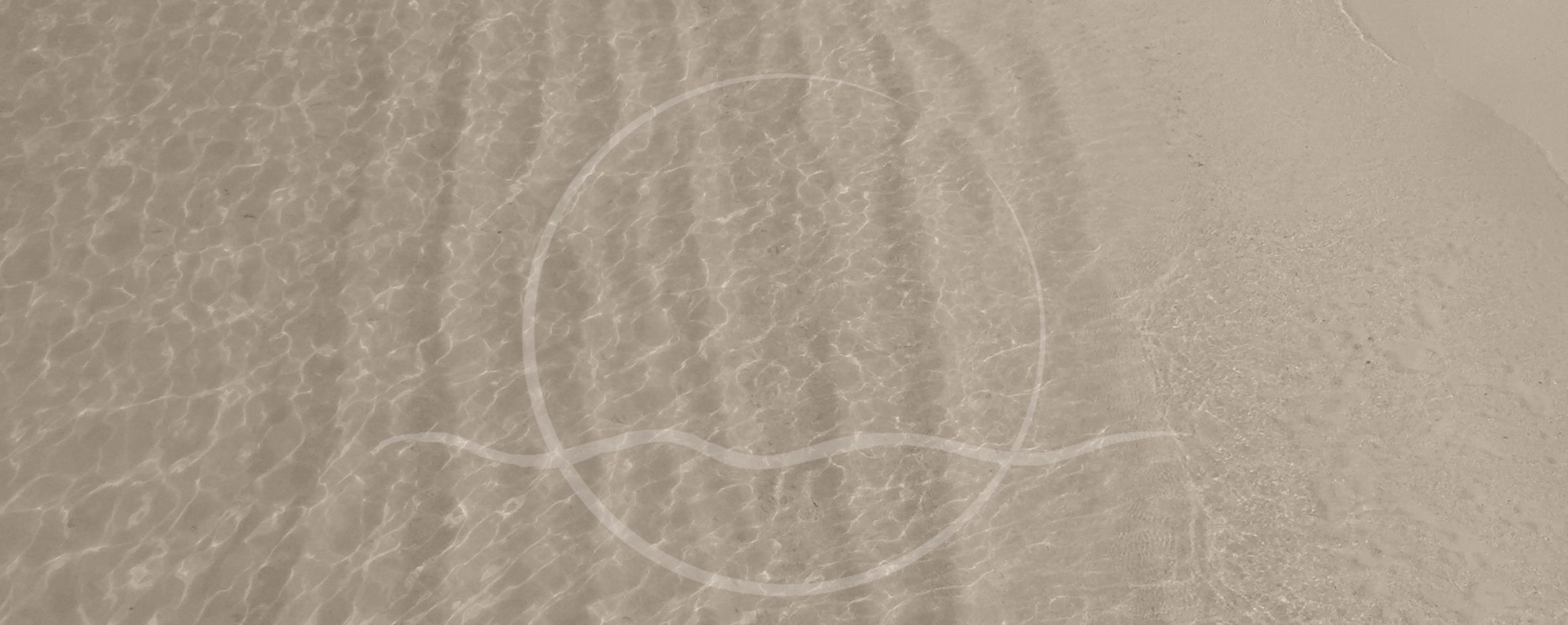 Calm water surface with abstract circle design.
