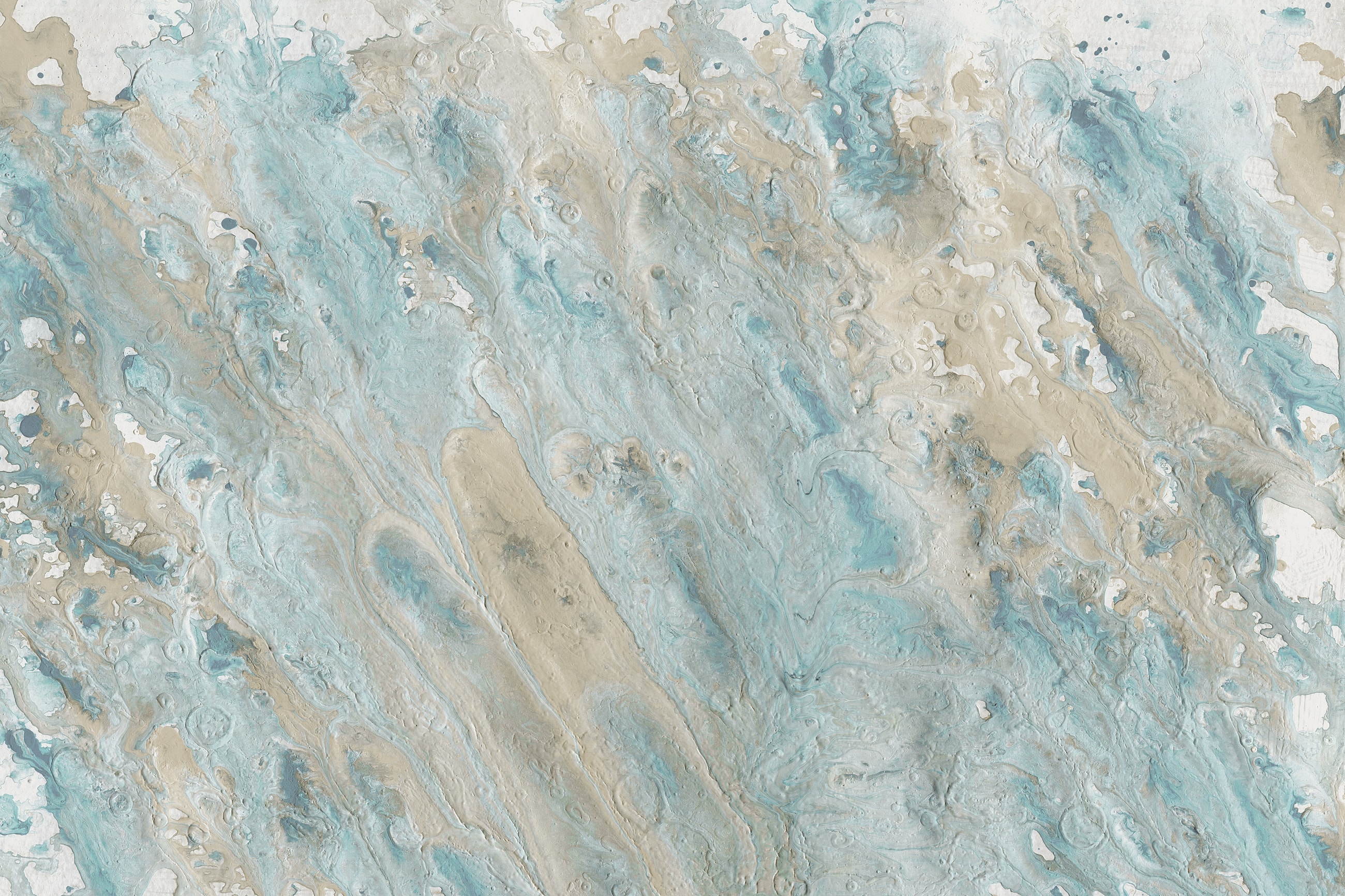 Waves meeting a sandy beach on a sunny day.