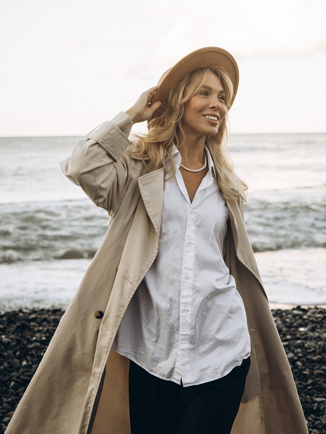 Waves meeting a sandy beach on a sunny day.