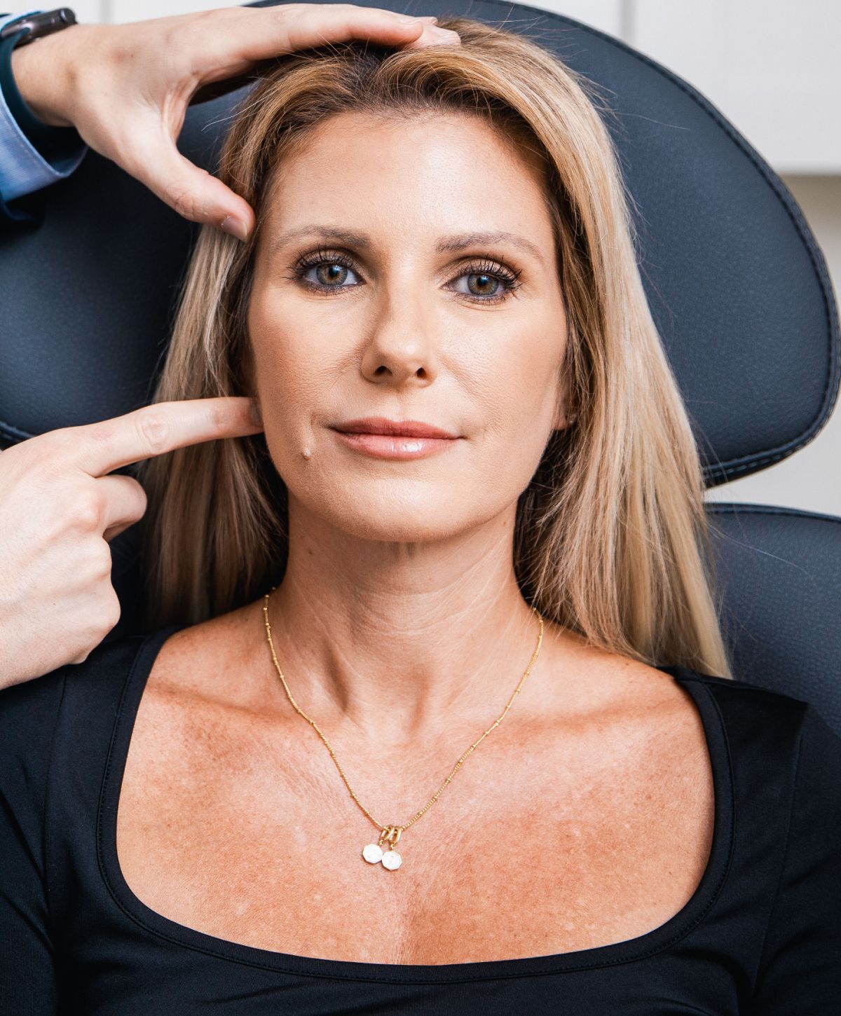Palm trees framing a cloudy sky view.