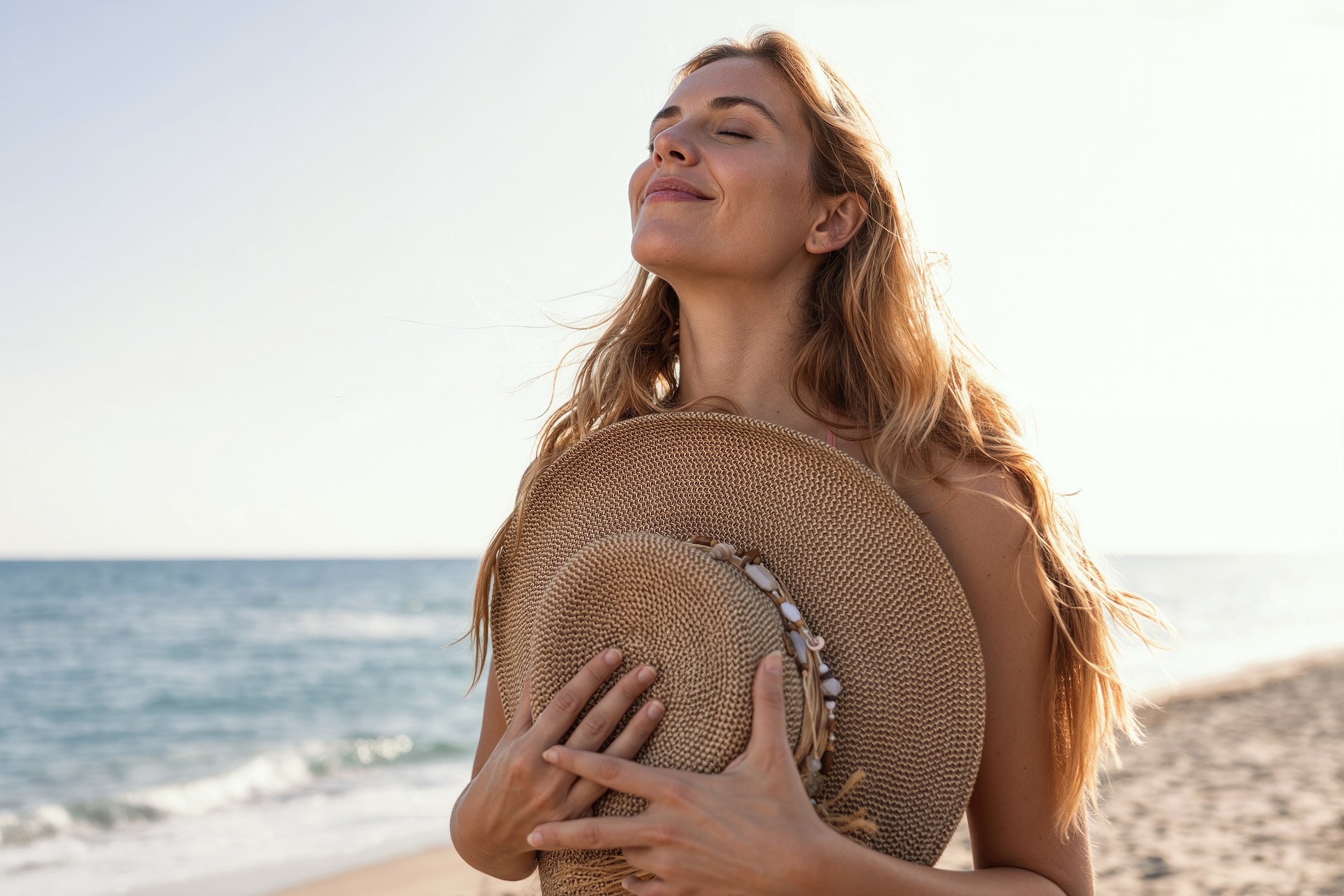 Woman enjoying a sunny day at the beach.