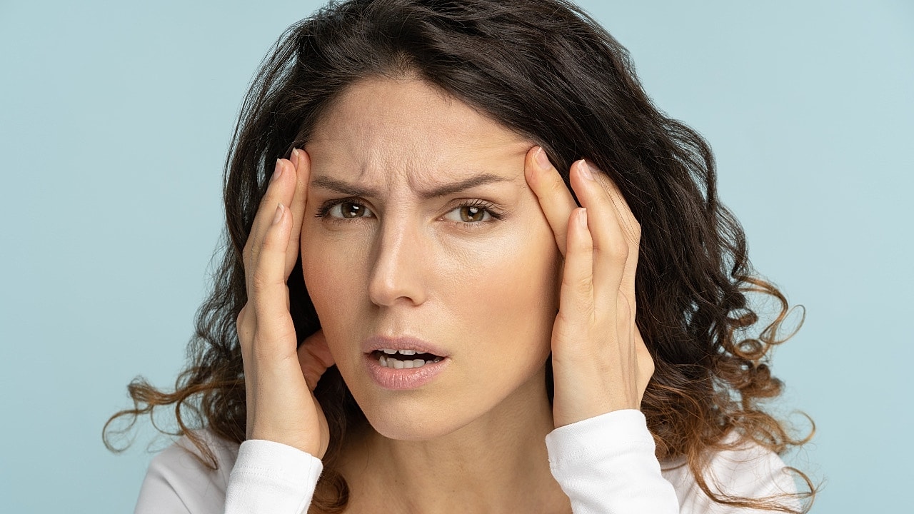 Woman's close-up face with smooth skin.